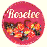 Beautifully decorated red velvet berry birthday cake with vibrant fruits and a glowing 'Roselee' name, adding a touch of sweetness and sparkle.
