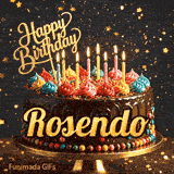 Chocolate cake with colorful icing swirls on top and the name Rosendo written on the chocolate frosting under lit candles.