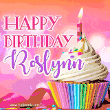 A vibrant birthday GIF featuring a rainbow-colored cupcake topped with white frosting, sprinkles, and a lit candle. The text reads 'Happy Birthday Roslynn' in bold pink and violet letters with white outline.