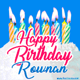 A cheerful animated GIF featuring colorful lit birthday candles on a white cake, with the text 'Happy Birthday Rownan' in bold red and blue script on a bright blue background.