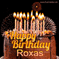 A rich chocolate cake topped with glowing birthday candles and surrounded by bright fireworks. The animated GIF displays the message 'Happy Birthday Roxas' in golden text.