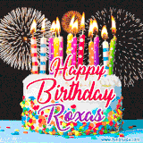 A lively happy birthday animated GIF showcasing a colorful birthday cake covered in sprinkles, topped with glowing candles, and surrounded by vibrant fireworks. The name 'Roxas' is featured in elegant script.