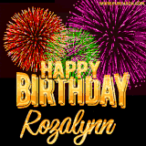 A golden 'Happy Birthday Rozalynn' message with vibrant fireworks in the background, creating a festive and celebratory vibe in this animated name GIF.
