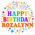 Happy Birthday Rozalynn' GIF with rainbow-colored letters, colorful stars, and fireworks on white background.