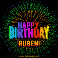 A colorful animated GIF featuring the text 'Happy Birthday Ruben!' in rainbow colors with a dynamic iridescent firework display in the background.
