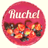 Beautifully decorated red velvet berry birthday cake with vibrant fruits and a glowing 'Ruchel' name, adding a touch of sweetness and sparkle.
