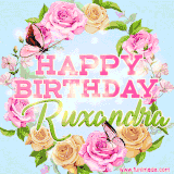A charming animated GIF featuring 'Happy Birthday Ruxandra' in pink and green text, surrounded by delicate roses, leaves, and fluttering butterflies on a soft light blue pastel background.