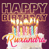 A colorful birthday cake topped with lit candles, with the words 'Happy Birthday Ruxandra' in bold glowing letters on a burgundy background. Animated flames add a festive touch.