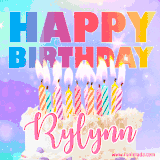 A vibrant animated name GIF with the words 'Happy Birthday Rylynn' with colorful candles on a creamy cake. The background sparkles with pastel shades, adding a festive touch.