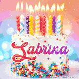 A cheerful white birthday cake with multicolor sprinkles, lit candles, and 'Sabrina' written in vibrant letters, in an animated GIF.