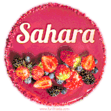 Beautifully decorated red velvet berry birthday cake with vibrant fruits and a glowing 'Sahara' name, adding a touch of sweetness and sparkle.