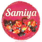 Beautifully decorated red velvet berry birthday cake with vibrant fruits and a glowing 'Samiya' name, adding a touch of sweetness and sparkle.