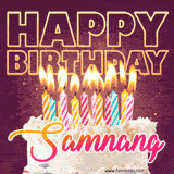 A colorful birthday cake topped with lit candles, with the words 'Happy Birthday Samnang' in bold glowing letters on a burgundy background. Animated flames add a festive touch.