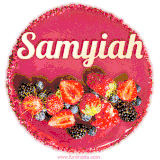 Beautifully decorated red velvet berry birthday cake with vibrant fruits and a glowing 'Samyiah' name, adding a touch of sweetness and sparkle.