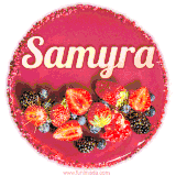 Beautifully decorated red velvet berry birthday cake with vibrant fruits and a glowing 'Samyra' name, adding a touch of sweetness and sparkle.