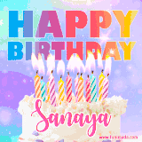 A vibrant animated name GIF with the words 'Happy Birthday Sanaya' with colorful candles on a creamy cake. The background sparkles with pastel shades, adding a festive touch.