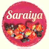Beautifully decorated red velvet berry birthday cake with vibrant fruits and a glowing 'Saraiya' name, adding a touch of sweetness and sparkle.