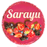 Beautifully decorated red velvet berry birthday cake with vibrant fruits and a glowing 'Sarayu' name, adding a touch of sweetness and sparkle.