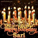 A glowing personalized birthday GIF with name Sari featuring lit candles with intricate designs, warm lighting, and the text 'Happy Birthday' in an elegant font.
