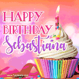 A vibrant birthday GIF featuring a rainbow-colored cupcake topped with white frosting, sprinkles, and a lit candle. The text reads 'Happy Birthday Sebastiana' in bold pink and violet letters with white outline.