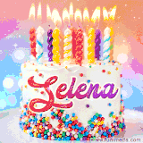 A cheerful white birthday cake with multicolor sprinkles, lit candles, and 'Selena' written in vibrant letters, in an animated GIF.