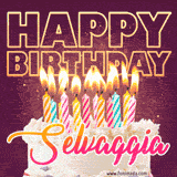 A colorful birthday cake topped with lit candles, with the words 'Happy Birthday Selvaggia' in bold glowing letters on a burgundy background. Animated flames add a festive touch.