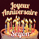 A Happy Birthday GIF in French featuring a festive birthday cake adorned with bright candles and the glowing text 'Joyeux Anniversaire Seyon' in a cheerful style.