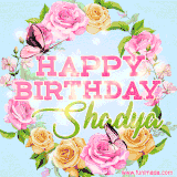 A charming animated GIF featuring 'Happy Birthday Shadya' in pink and green text, surrounded by delicate roses, leaves, and fluttering butterflies on a soft light blue pastel background.
