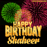 A captivating GIF with bursts of green, pink, and orange fireworks lighting up the night sky, accompanied by 'Happy Birthday Shaheer' in glowing golden text.
