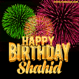 A captivating GIF with bursts of green, pink, and orange fireworks lighting up the night sky, accompanied by 'Happy Birthday Shahid' in glowing golden text.