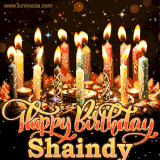 A glowing personalized birthday GIF with name Shaindy featuring lit candles with intricate designs, warm lighting, and the text 'Happy Birthday' in an elegant font.