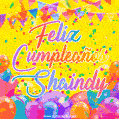 A bright and festive GIF with the text 'Feliz Cumpleaños Shaindy' in Spanish in colorful fonts, surrounded by confetti, balloons, and festive banners on a vibrant yellow background.