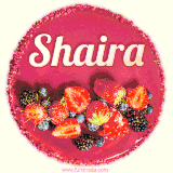 Beautifully decorated red velvet berry birthday cake with vibrant fruits and a glowing 'Shaira' name, adding a touch of sweetness and sparkle.