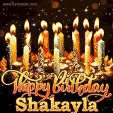 A glowing personalized birthday GIF with name Shakayla featuring lit candles with intricate designs, warm lighting, and the text 'Happy Birthday' in an elegant font.