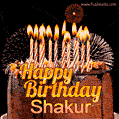 A rich chocolate cake topped with glowing birthday candles and surrounded by bright fireworks. The animated GIF displays the message 'Happy Birthday Shakur' in golden text.