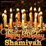 A glowing personalized birthday GIF with name Shamiyah featuring lit candles with intricate designs, warm lighting, and the text 'Happy Birthday' in an elegant font.