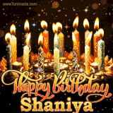 A glowing personalized birthday GIF with name Shaniya featuring lit candles with intricate designs, warm lighting, and the text 'Happy Birthday' in an elegant font.