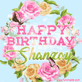 A charming animated GIF featuring 'Happy Birthday Shanzay' in pink and green text, surrounded by delicate roses, leaves, and fluttering butterflies on a soft light blue pastel background.