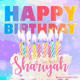 A vibrant animated name GIF with the words 'Happy Birthday Shariyah' with colorful candles on a creamy cake. The background sparkles with pastel shades, adding a festive touch.