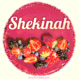 Beautifully decorated red velvet berry birthday cake with vibrant fruits and a glowing 'Shekinah' name, adding a touch of sweetness and sparkle.