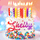 A cheerful white birthday cake with multicolor sprinkles, lit candles, and 'Shelby' written in vibrant letters, in an animated GIF.