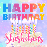 A vibrant animated name GIF with the words 'Happy Birthday Sheshebens' with colorful candles on a creamy cake. The background sparkles with pastel shades, adding a festive touch.