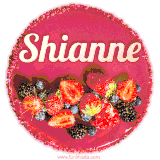 Beautifully decorated red velvet berry birthday cake with vibrant fruits and a glowing 'Shianne' name, adding a touch of sweetness and sparkle.