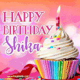 A vibrant birthday GIF featuring a rainbow-colored cupcake topped with white frosting, sprinkles, and a lit candle. The text reads 'Happy Birthday Shika' in bold pink and violet letters with white outline.