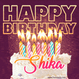 A colorful birthday cake topped with lit candles, with the words 'Happy Birthday Shika' in bold glowing letters on a burgundy background. Animated flames add a festive touch.