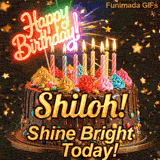 A rich chocolate frosted cake on a gold stand with glowing yellow candles, personalized with the name Shiloh!