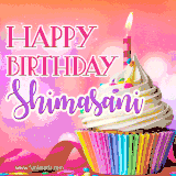A vibrant birthday GIF featuring a rainbow-colored cupcake topped with white frosting, sprinkles, and a lit candle. The text reads 'Happy Birthday Shimasani' in bold pink and violet letters with white outline.