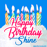 A cheerful animated GIF featuring colorful lit birthday candles on a white cake, with the text 'Happy Birthday Shine' in bold red and blue script on a bright blue background.