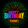 A colorful animated GIF featuring the text 'Happy Birthday Shine!' in rainbow colors with a dynamic iridescent firework display in the background.