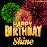 A captivating GIF with bursts of green, pink, and orange fireworks lighting up the night sky, accompanied by 'Happy Birthday Shine' in glowing golden text.